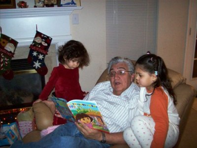 Grandpa Humberto reads the kids a story.
